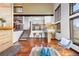Bright living room featuring hardwood floors, high ceilings, and a cozy seating area with natural light at 3900 Bogey Ct, Longmont, CO 80503