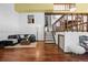 A multilevel living room boasts hardwood floors and access to the dining room at 3900 Bogey Ct, Longmont, CO 80503