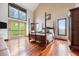 Spacious bedroom with high ceilings, hardwood floors, and a balcony with scenic views at 3900 Bogey Ct, Longmont, CO 80503