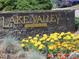 Entrance sign for Lake Valley Golf Club surrounded by colorful flowers at 3900 Bogey Ct, Longmont, CO 80503