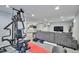 Basement with home gym equipment and a relaxing entertainment area at 6179 S Bemis St, Littleton, CO 80120