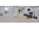 Finished basement featuring neutral paint, carpet, and a gray sofa for a comfortable living space at 6179 S Bemis St, Littleton, CO 80120