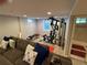 Finished basement includes workout equipment and a comfortable couch for relaxing at 6179 S Bemis St, Littleton, CO 80120