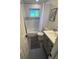 Traditional bathroom featuring shower-tub combo with decorative tile and classic fixtures at 6179 S Bemis St, Littleton, CO 80120