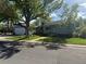 Charming single-story home with well-maintained lawn and mature trees providing ample shade at 6179 S Bemis St, Littleton, CO 80120