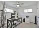 Bright office featuring white walls, natural light, a ceiling fan, and functional layout at 6179 S Bemis St, Littleton, CO 80120