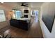 Spacious living room featuring a decorative fireplace, wood floors, and open layout at 6179 S Bemis St, Littleton, CO 80120