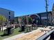 Outdoor courtyard with picnic tables and mural on the side of the building at 3195 Blake St # 201, Denver, CO 80205