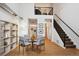 Dining area with hardwood floors and a glass table at 3195 Blake St # 201, Denver, CO 80205