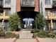 Gated entrance to the complex with landscaping at 3195 Blake St # 201, Denver, CO 80205