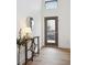 Bright entryway with a modern console table and mirror at 3195 Blake St # 201, Denver, CO 80205