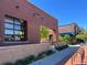 Brick building housing Blue Sparrow Coffee, featuring a modern storefront and outdoor seating area at 3195 Blake St # 201, Denver, CO 80205