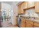 Eat-in kitchen with stainless steel appliances and view to dining area at 3195 Blake St # 201, Denver, CO 80205