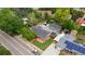Aerial view of a home with a well-maintained yard, detached garage, and mature trees at 1263 W 103Rd Pl, Northglenn, CO 80260