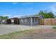 Spacious backyard features a covered carport and a large concrete area, perfect for outdoor activities at 1263 W 103Rd Pl, Northglenn, CO 80260