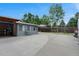 Expansive backyard features a large concrete area with a covered portion, ideal for entertaining and recreation at 1263 W 103Rd Pl, Northglenn, CO 80260