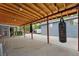 Spacious covered patio with rustic wood ceiling, creating an inviting space for outdoor entertaining and relaxation at 1263 W 103Rd Pl, Northglenn, CO 80260