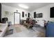 Spacious garage equipped with a drum set and recording setup offers versatility as a music or hobby space at 1263 W 103Rd Pl, Northglenn, CO 80260
