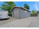 Detached garage with ample parking space and a trailer, providing convenient storage and functionality at 1263 W 103Rd Pl, Northglenn, CO 80260