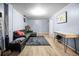 A bright living room with a sofa, a rug, and light blue walls at 1263 W 103Rd Pl, Northglenn, CO 80260