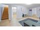 A cozy living room with wood flooring and a small desk with an artistic area at 1263 W 103Rd Pl, Northglenn, CO 80260