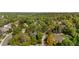 An aerial view shows a neighborhood with mature trees and well-maintained homes at 8535 E Otero Cir, Centennial, CO 80112