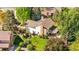 An aerial view showcases a home with a well-manicured backyard, patio, and lush landscaping at 8535 E Otero Cir, Centennial, CO 80112