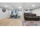 Finished basement featuring an exercise area, and a relaxation zone with a comfortable couch at 8535 E Otero Cir, Centennial, CO 80112