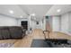 View of basement recreational area with updated floors, neutral paint, and recreational equipment at 8535 E Otero Cir, Centennial, CO 80112