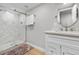 Modern bathroom features a glass shower, updated fixtures, and stylish vanity with marble countertop at 8535 E Otero Cir, Centennial, CO 80112
