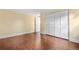 Bedroom with hardwood floors, natural light, neutral colors, and a large closet at 8535 E Otero Cir, Centennial, CO 80112