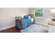 Cozy bedroom with hardwood floors, natural lighting, a twin bed, and area rug at 8535 E Otero Cir, Centennial, CO 80112