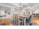 Bright dining room with hardwood floors, open floor plan, chandelier, and backyard access at 8535 E Otero Cir, Centennial, CO 80112
