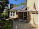 Lovely home exterior with a brick facade, modern solar panels, and a manicured lawn at 8535 E Otero Cir, Centennial, CO 80112