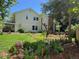 Charming home exterior showcasing a well-manicured lawn, vibrant garden, and covered patio for outdoor enjoyment at 8535 E Otero Cir, Centennial, CO 80112