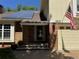 Inviting home exterior with modern solar panels, brick accents, and a welcoming front door at 8535 E Otero Cir, Centennial, CO 80112