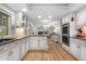 Well-appointed kitchen featuring granite countertops, white cabinetry, and stainless steel appliances at 8535 E Otero Cir, Centennial, CO 80112