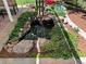 Close up of koi pond featuring rock accents, lush greenery, and a peaceful waterfall at 8535 E Otero Cir, Centennial, CO 80112
