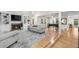 Bright living room with fireplace, built-in shelving, hardwood floors, and an open floor plan at 8535 E Otero Cir, Centennial, CO 80112