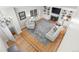 Living room with hardwood floors, a fireplace, and a TV mounted above the mantel at 8535 E Otero Cir, Centennial, CO 80112