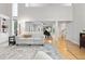 Open-concept living area with hardwood floors, piano, and seamless transition to other living spaces at 8535 E Otero Cir, Centennial, CO 80112