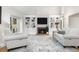Cozy living room with a brick fireplace, built-in bookshelves, and comfortable seating arrangement at 8535 E Otero Cir, Centennial, CO 80112