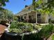 Serene covered patio featuring a rock garden, comfortable seating, and views of the beautifully landscaped yard at 8535 E Otero Cir, Centennial, CO 80112