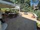 Outdoor patio with dining and lounge seating, a fire pit, and view of garden at 8535 E Otero Cir, Centennial, CO 80112