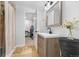 Bathroom featuring a modern sink, tile flooring, and open doorway at 1812 S Hazel Ct, Denver, CO 80219