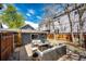 Backyard patio area featuring comfortable seating, string lights, and privacy fence at 444 Inca St, Denver, CO 80204