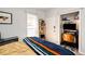 Cozy bedroom with hardwood floors, natural light, desk, and closet at 444 Inca St, Denver, CO 80204