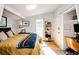 Bright bedroom featuring hardwood floors, natural light, and neutral walls at 444 Inca St, Denver, CO 80204