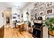 Charming dining room filled with artwork, plants, and vintage decor at 444 Inca St, Denver, CO 80204