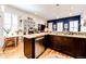 Modern kitchen with granite countertops, stainless steel appliances, and bright, natural light at 444 Inca St, Denver, CO 80204
